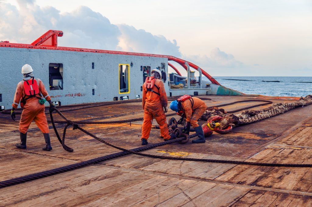 Vessel crew preparing vessel for static tow tanker lifting